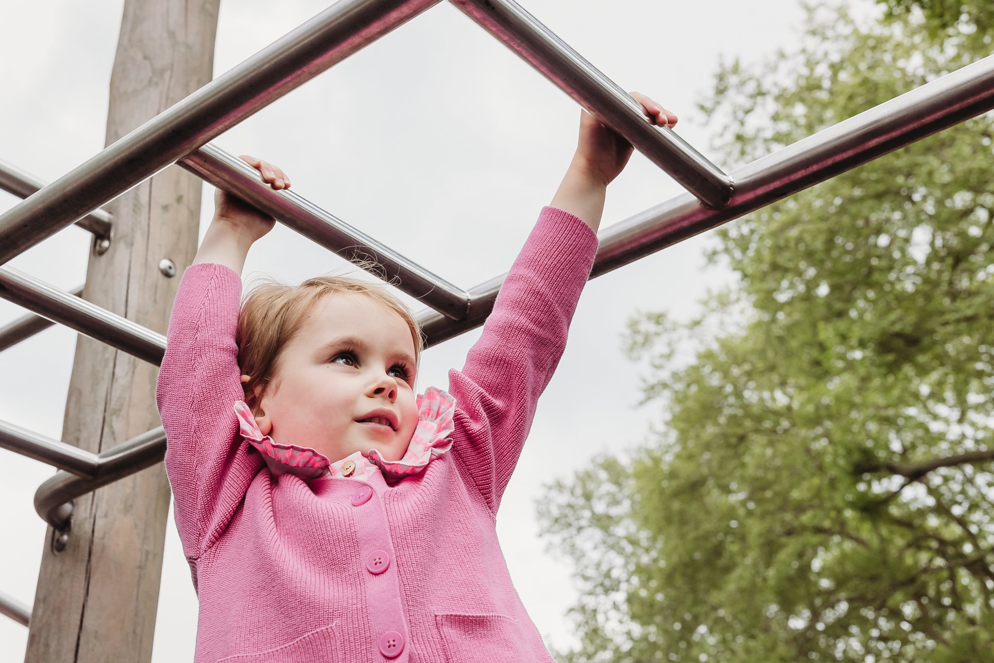 Girl on climbing frame.jpg
