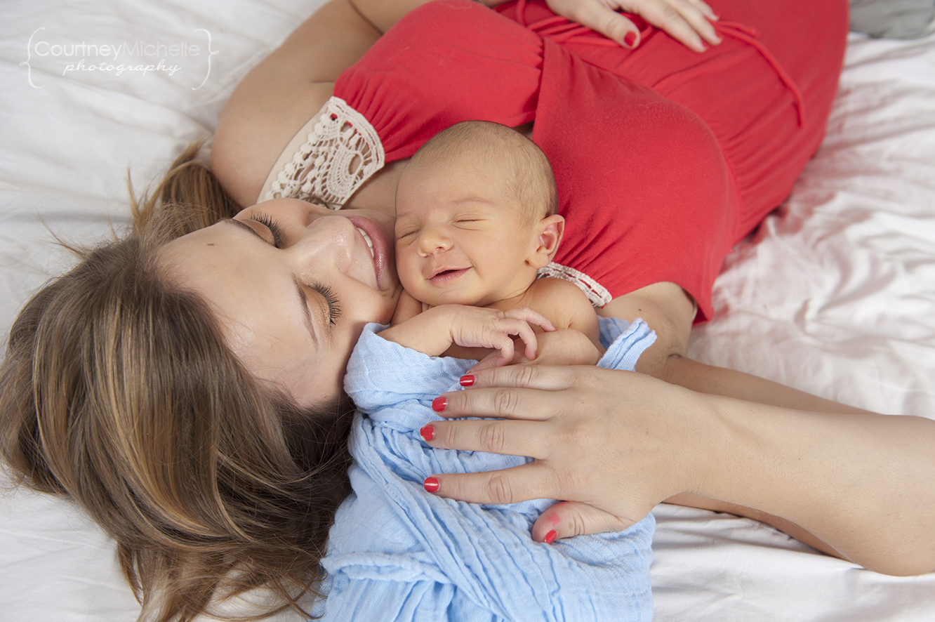 mom-laying-with-smiling-newborn-baby-boy-chicago-newborn-lifestyle-photography-by-courtney-laper.jpg