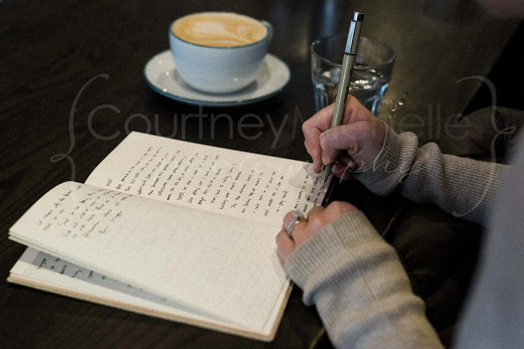 Woman Journaling in Ipsento Coffee