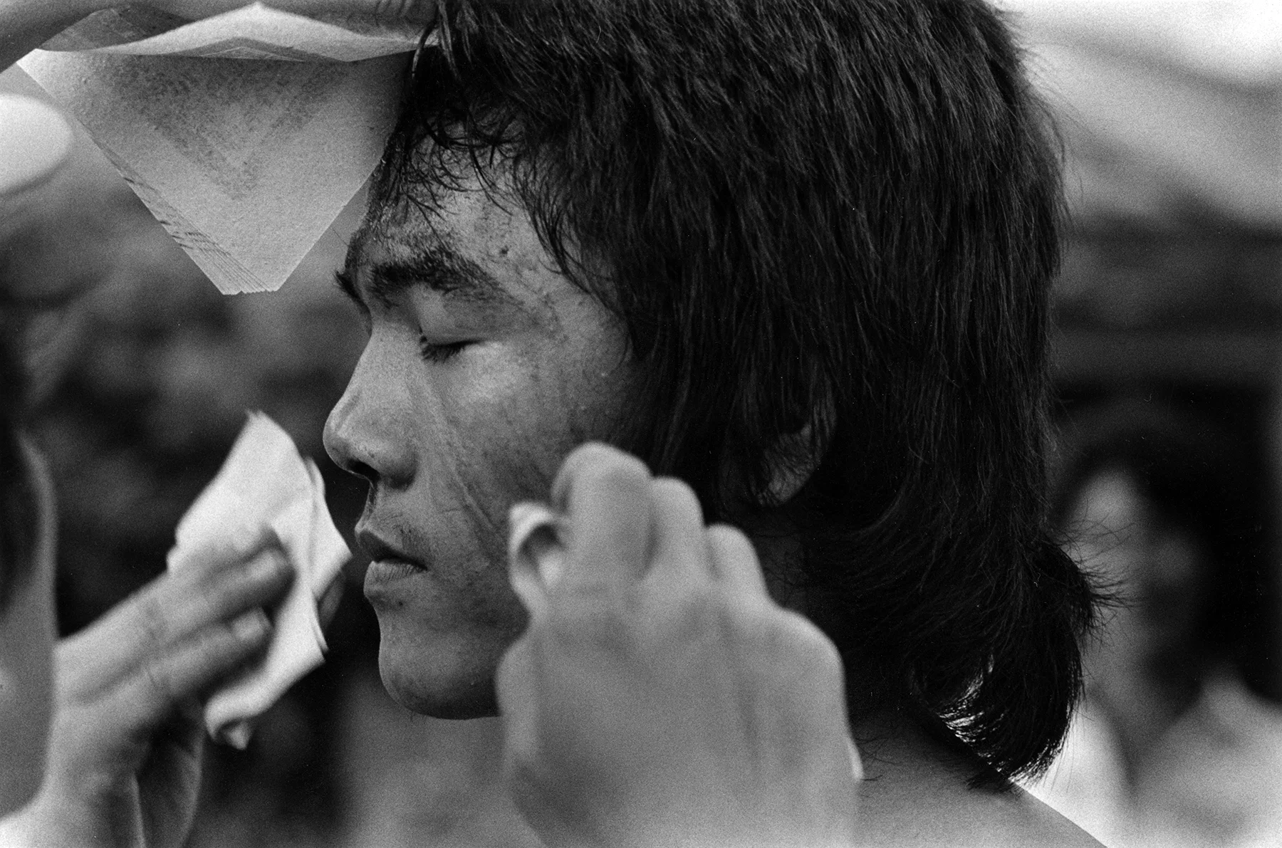 In 1985, Tom Ferentz travelled to Taiwan to exhibit his photographs at the American Cultural Center Gallery in Taipei. Through the exhibition, he got to know several photographers. He joined some to visit a small town outside of Kao Hsiang, which was having a ceremonial day. The whole town was involved. Parades with dancers traversed the streets. Occasionally, they stopped to deeply breathe in smoke from pots with sticks of some kind of incense. It appeared to augment their dancing and they entered a trance-like state. Stylized martial arts-like movements were augmented by flagellation: striking themselves on the back with thorny objects, drawing blood. Children participated in the procession, not the flagellation. Monitors closely watched each one. They had an intense concern for the children. Tom Ferentz is Founder and Artistic Director of Sixth Street Photography Workshop and 6th On 7th Gallery. In those days, he was more or less a documentary style photographer. Since, he branched out to other areas, including poetic narrative photo-text pieces, theatrical figure studies and the writing of fiction. In Taiwan 1995 was photographed with film.