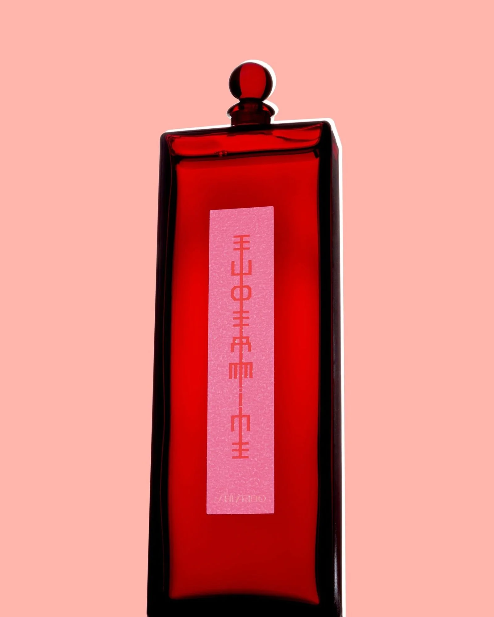red-perfume-bottle-pink-background.jpg