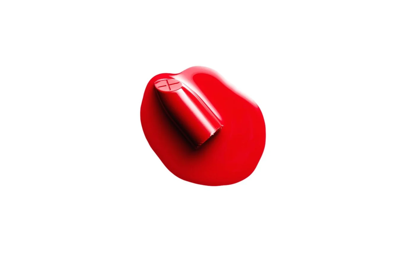 Red lipstick in a puddle of red liquid, resting on a white surface.