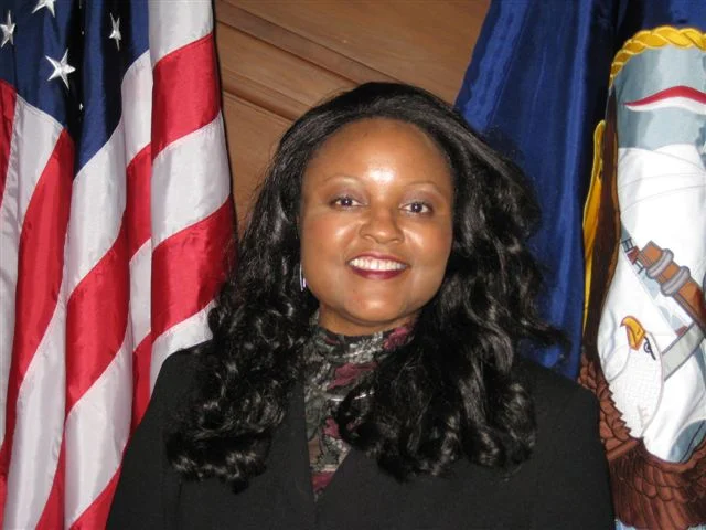 MS. JANIE MINES (USNA ’80)