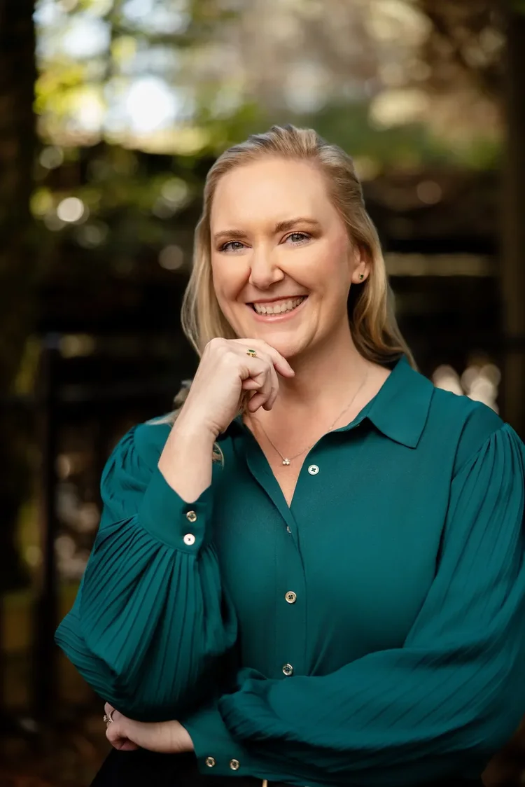 Professional LinkedIn headshot of a woman in a teal blouse in Greenville SC