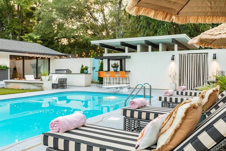 Pool of a mid-century modern custom home in Greenville, SC, interiors by Diggs Design.