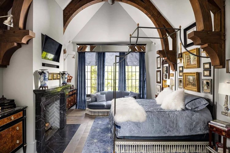 Primary bedroom of a custom home, interiors by Villa Verona Design.