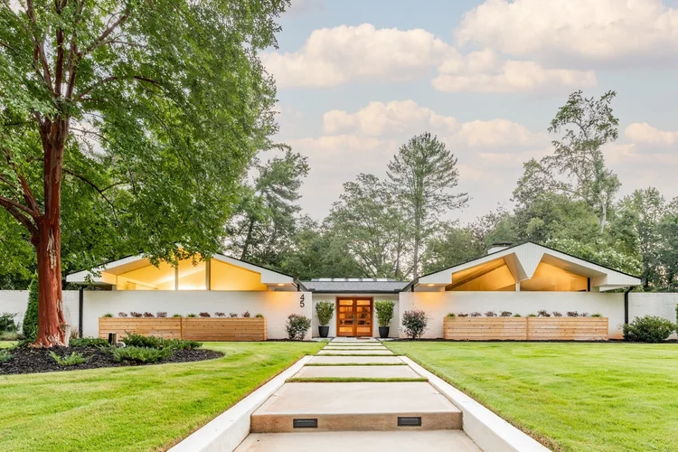 Exterior of a mid-century modern custom home in Greenville, SC, interiors by Diggs Design.