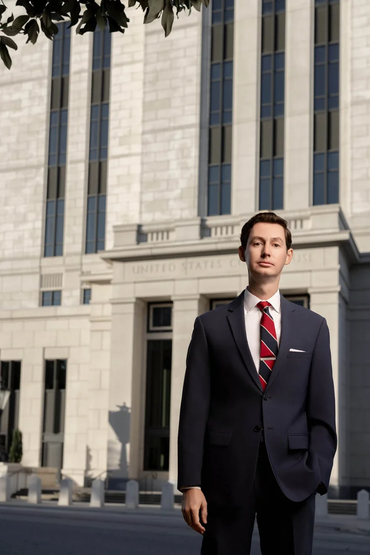 Attorney headshot at courthouse columns, Greenville SC