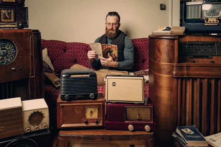 Collector with vintage radios, editorial maker feature, Asheville NC