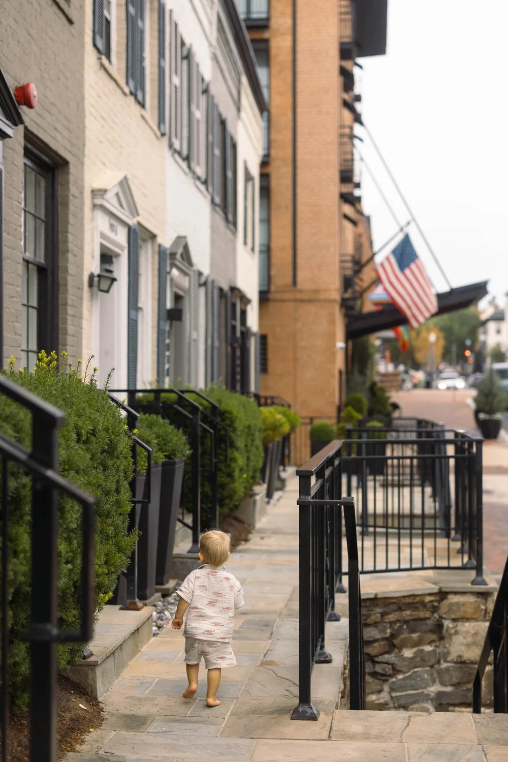 toddler-walks-barefoot-georgetown-rowhomes.jpg