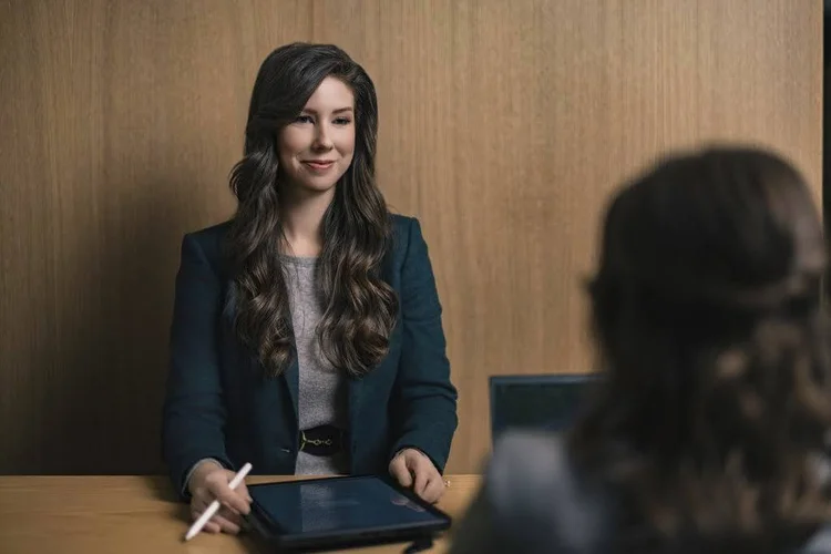 Law firm branding photo of attorneys meeting with a tablet, Greenville SC