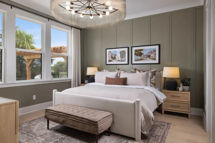 Primary bedroom in a luxury custom home in Grande Dunes, Murrells Inlet, SC, built by Toll Brothers. Architectural photography by Jack Robert Connolly.