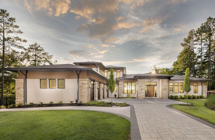 Twilight exterior of the Bright Water, built by Gabriel Builders.