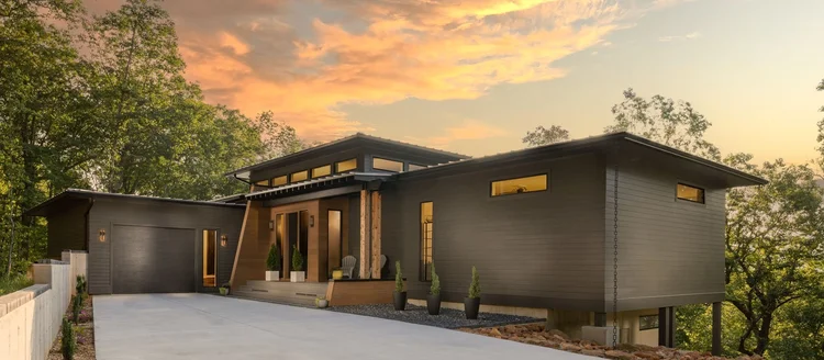 Twilight exterior of a custom home, built by Fortress Architecture.