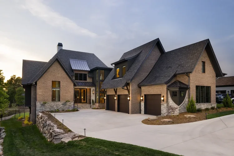 Twilight exterior of a custom home in Belmont, NC, designed by Vinyet Architects. Architectural photography by Jack Robert Connolly.