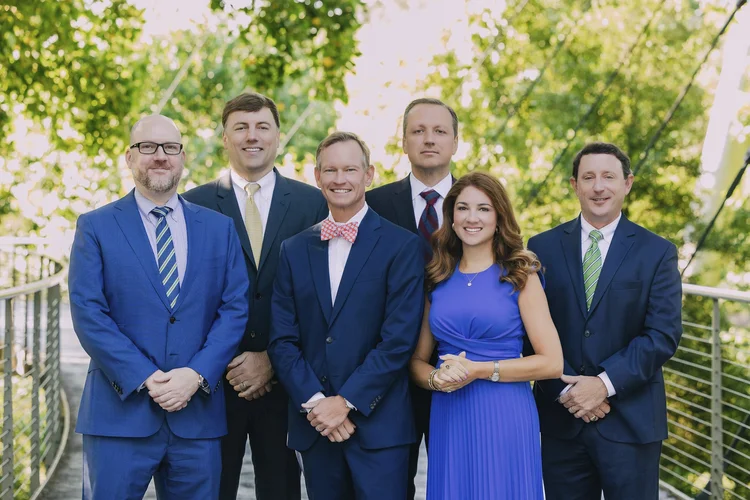 Law firm team group photo on a bridge in Greenville, SC