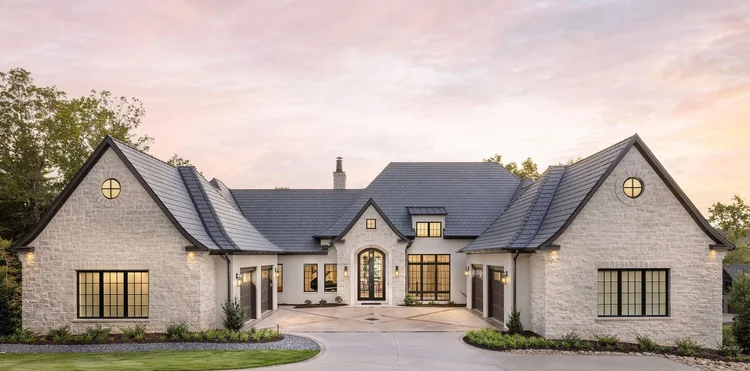 Twilight exterior of a custom home, built by Gabriel Builders (view 7).
