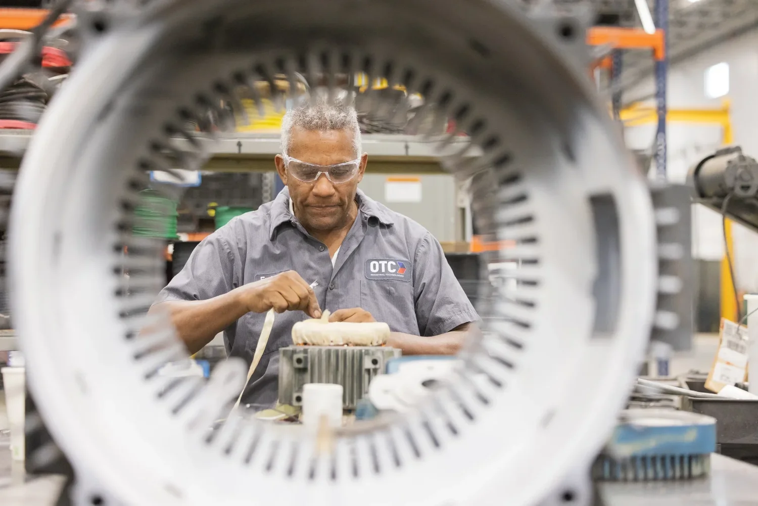 Worker at the OTC industrial facility grand opening — industrial photography