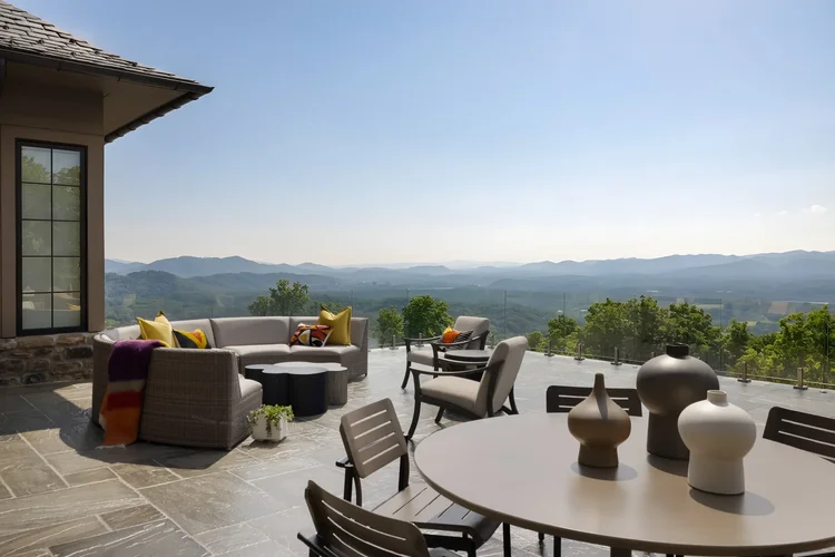 Outdoor porch of a custom home in Asheville, NC, interiors by Northside Interior Design. Architectural photography by Jack Robert Connolly.