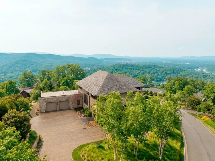 Aerial view of a custom home in Bridgeford, Asheville, NC, interiors by Northside Interior Design. Architectural photography by Jack Robert Connolly.