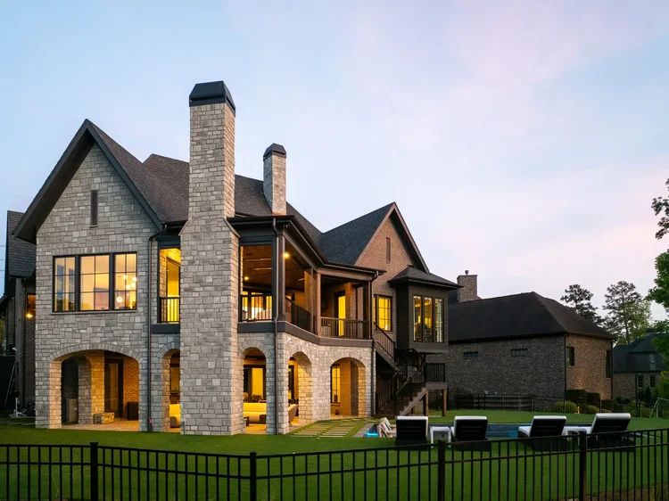 Twilight exterior of a custom home in Belmont, NC, designed by Vinyet Architects. Architectural photography by Jack Robert Connolly.