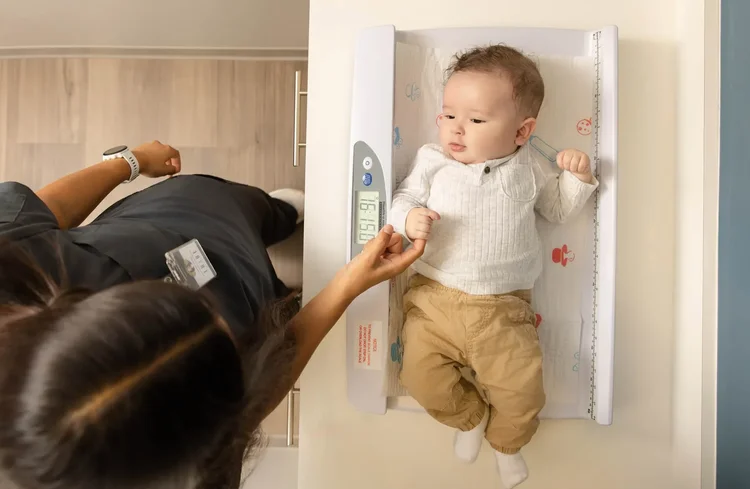 Infant health checkup with weight measurement