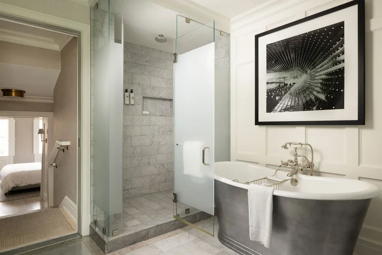 Suite bathroom with freestanding tub and glass shower at Rosewood Washington, DC
