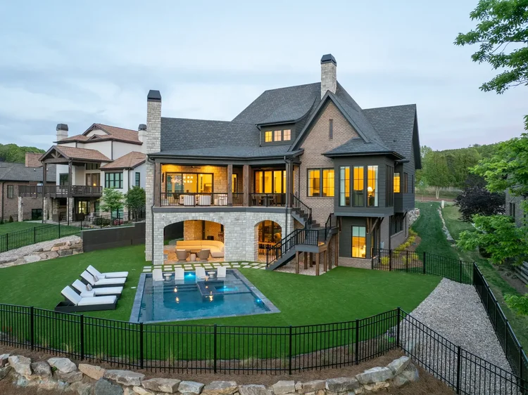 Twilight exterior of a custom home in Belmont, NC, designed by Vinyet Architects. Architectural photography by Jack Robert Connolly.