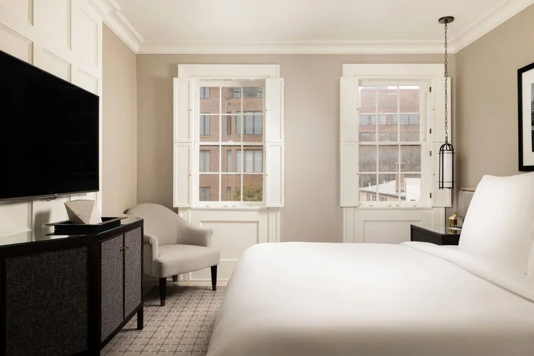 Guest room with shuttered windows at Rosewood Washington, DC