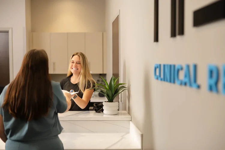 Patient checking in at a medical clinic front desk