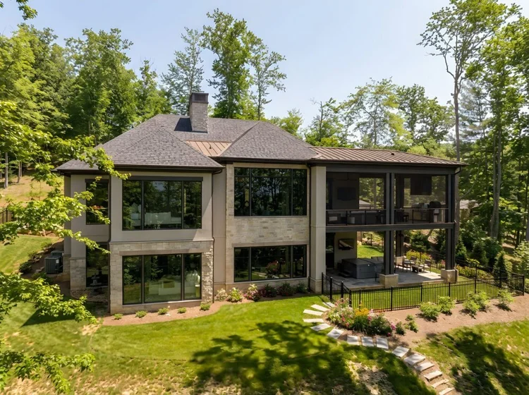 Aerial view of a custom home exterior, interiors by Northside Interior Design.