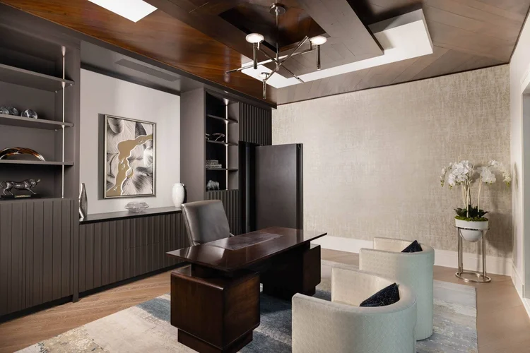 Home office of a custom home, built by Gabriel Builders, featuring hidden door.