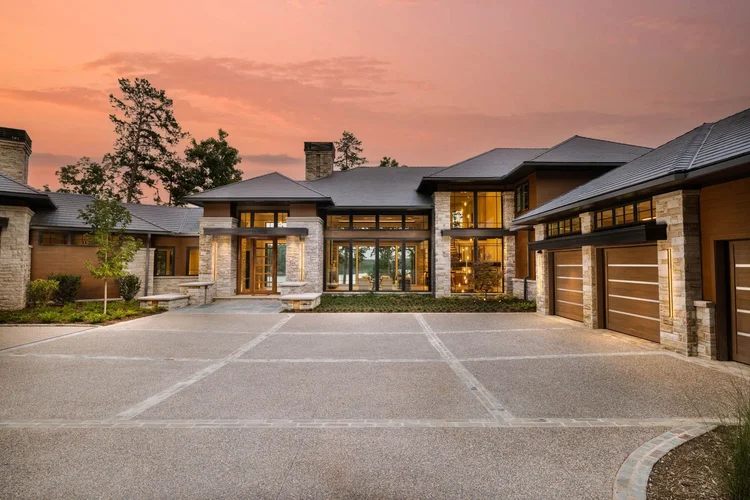 Twilight exterior of a custom home, built by Gabriel Builders (view 5).