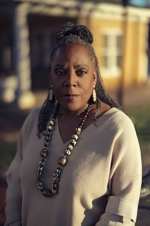 Poet Glenis Redmond photographed in warm direct sunlight in Greenville, SC