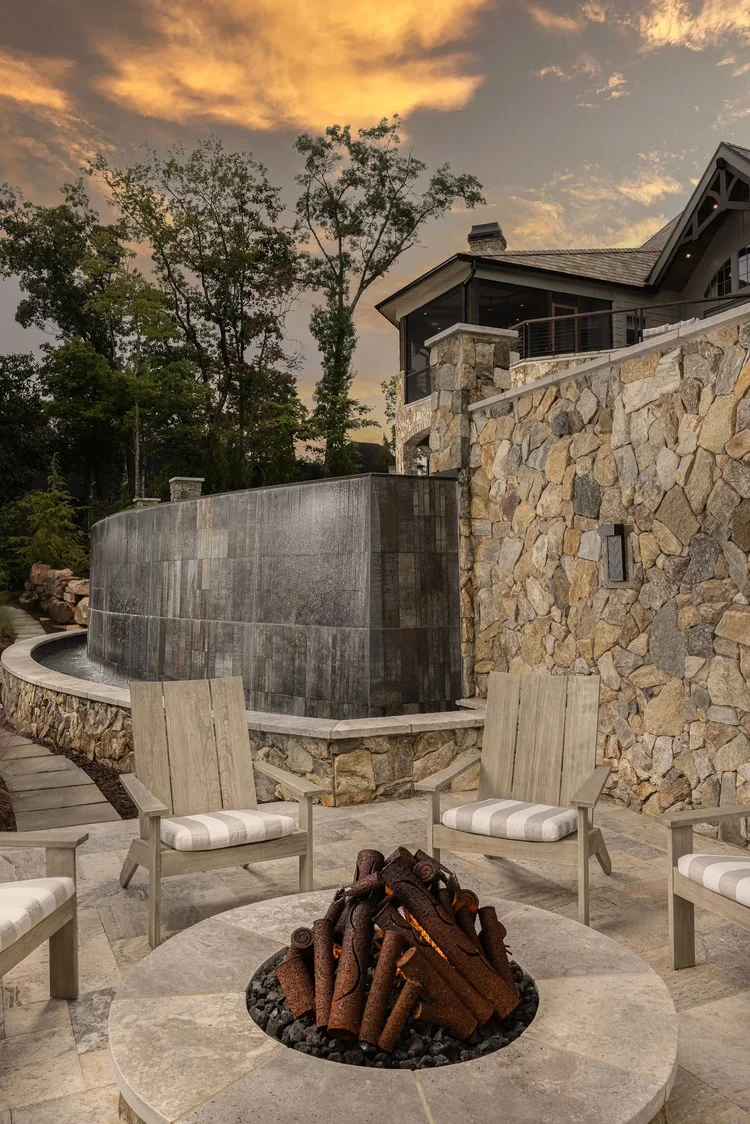Outdoor fire pit of a custom home in Greenville, SC, interiors by Villa Verona Design.