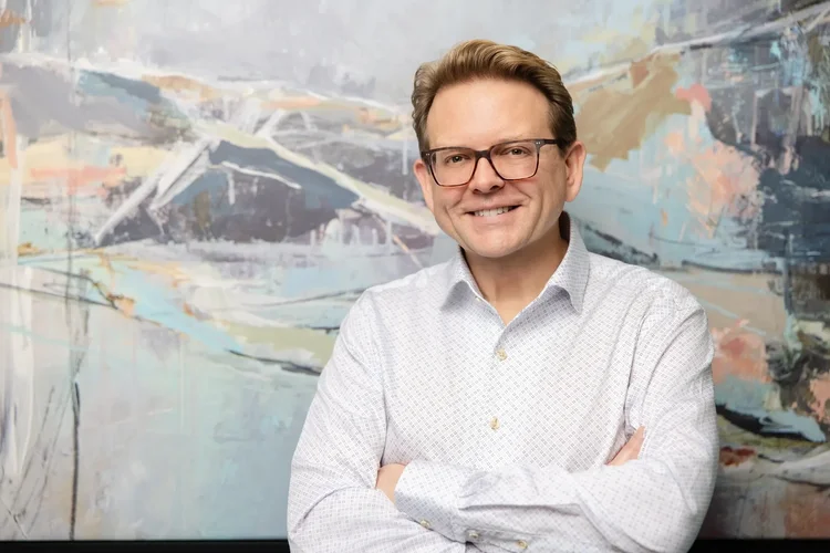 Executive environmental portrait with brand artwork in Greenville, SC by Jack Robert Photo