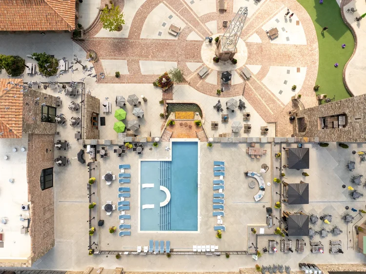 Aerial view of the pool at Bridgeway Station, a mixed-use development — commercial architecture photography by Jack Robert.