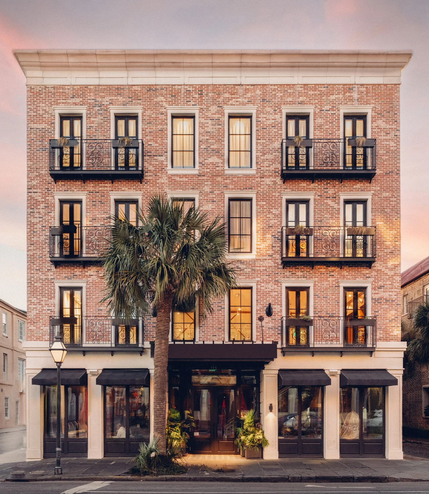 The Palmetto Hotel exterior at dusk in downtown Charleston SC, boutique hotel hospitality photography by Jack Robert