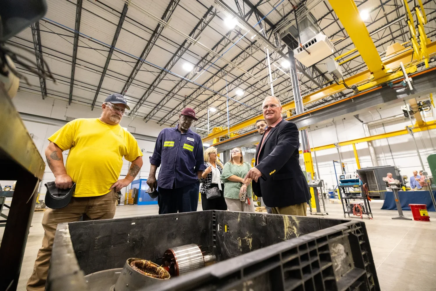 Grand-opening facility tour at the OTC industrial building — construction milestone photography by Jack Robert.