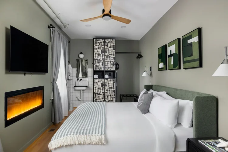 Interior of a bedroom in a commercial hospitality space — hospitality architecture photography by Jack Robert.