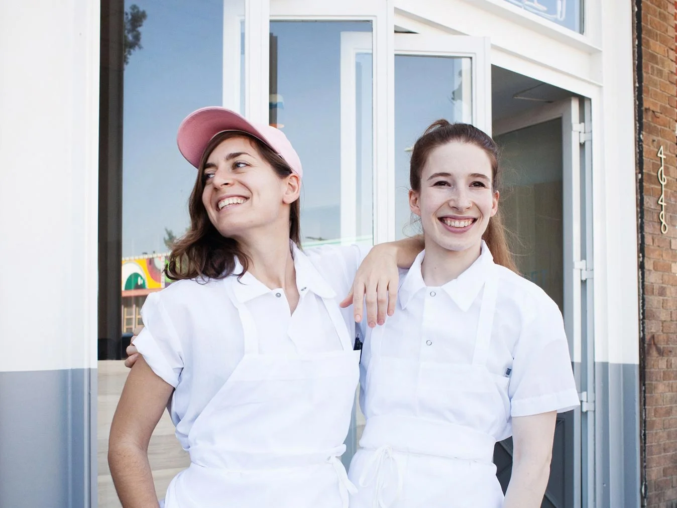 sara kramer & sarah hymanson in front of kismet / chef & partners of the kismet family