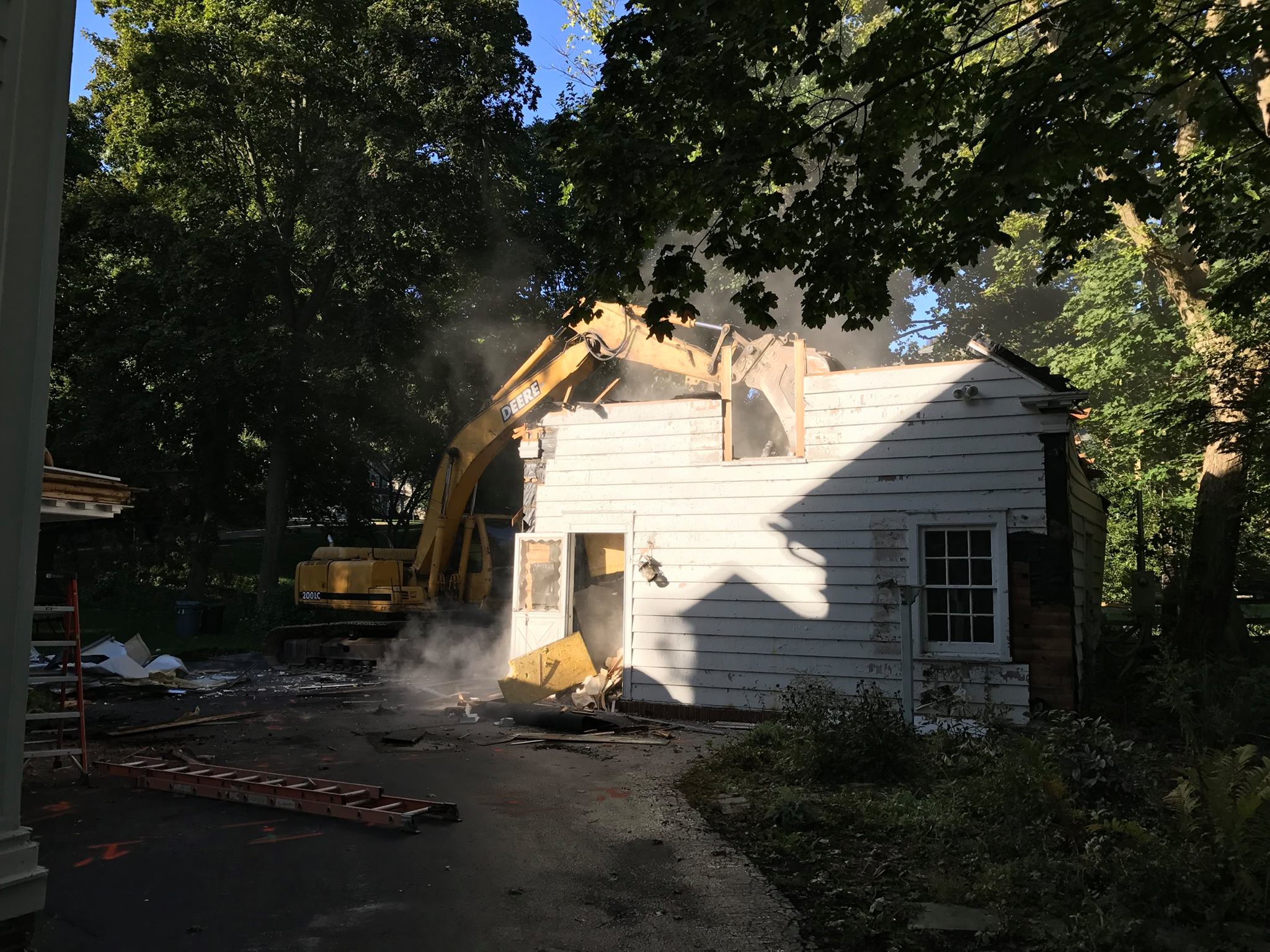 Demo crew making short work of the remainder of the garage and clearing the site for the addition.