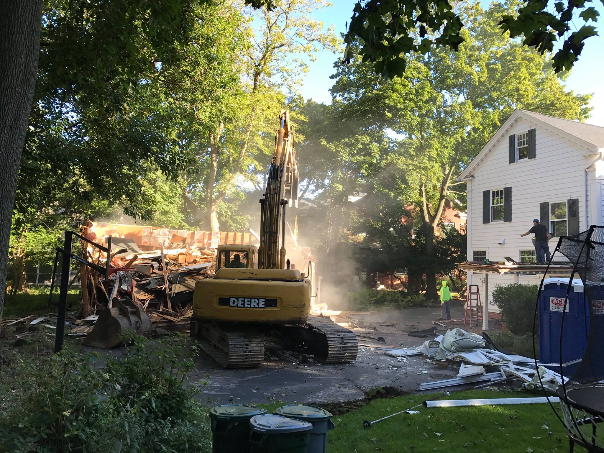 Demo crew making short work of the remainder of the garage and clearing the site for the addition.