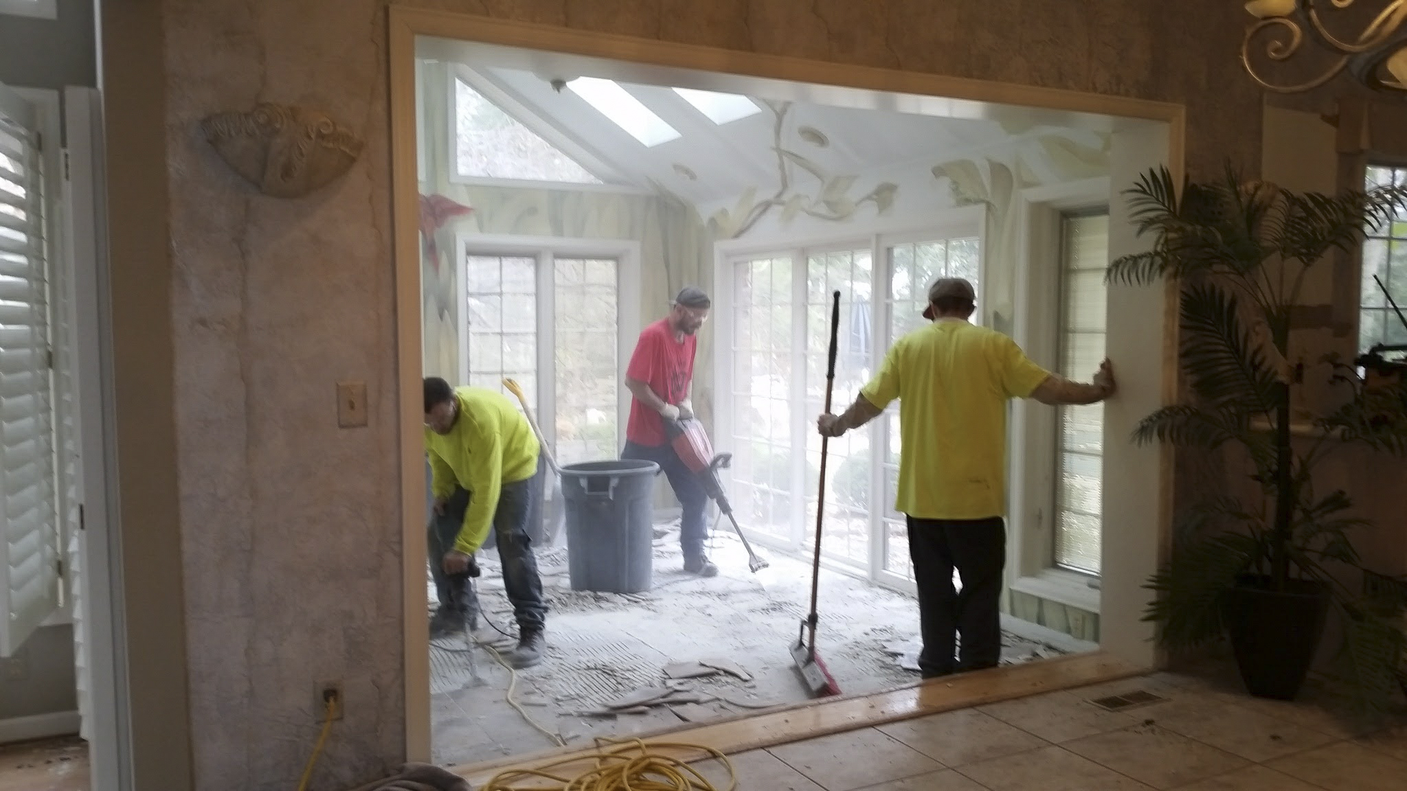 Mike's Hauling demo crew hard at work demoing the sunroom floor. Thanks for all your hard work!