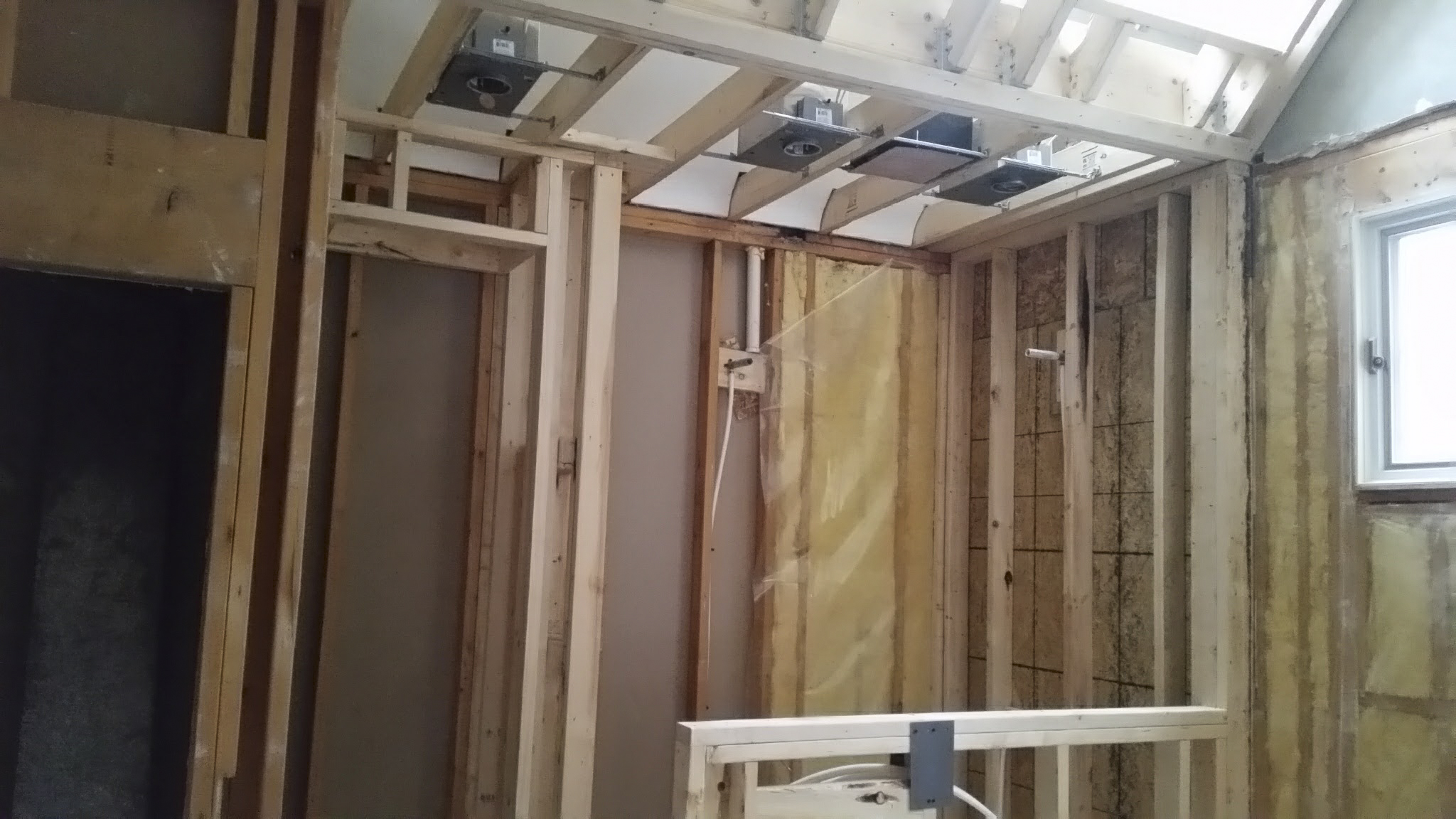 Shower ceiling and skylight framing done. Electrical work in progess