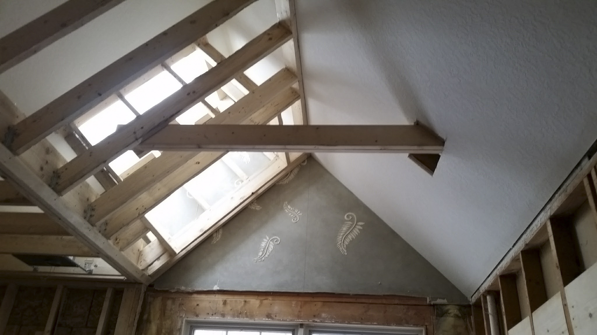New skylight shaft with exposed timber ceiling.