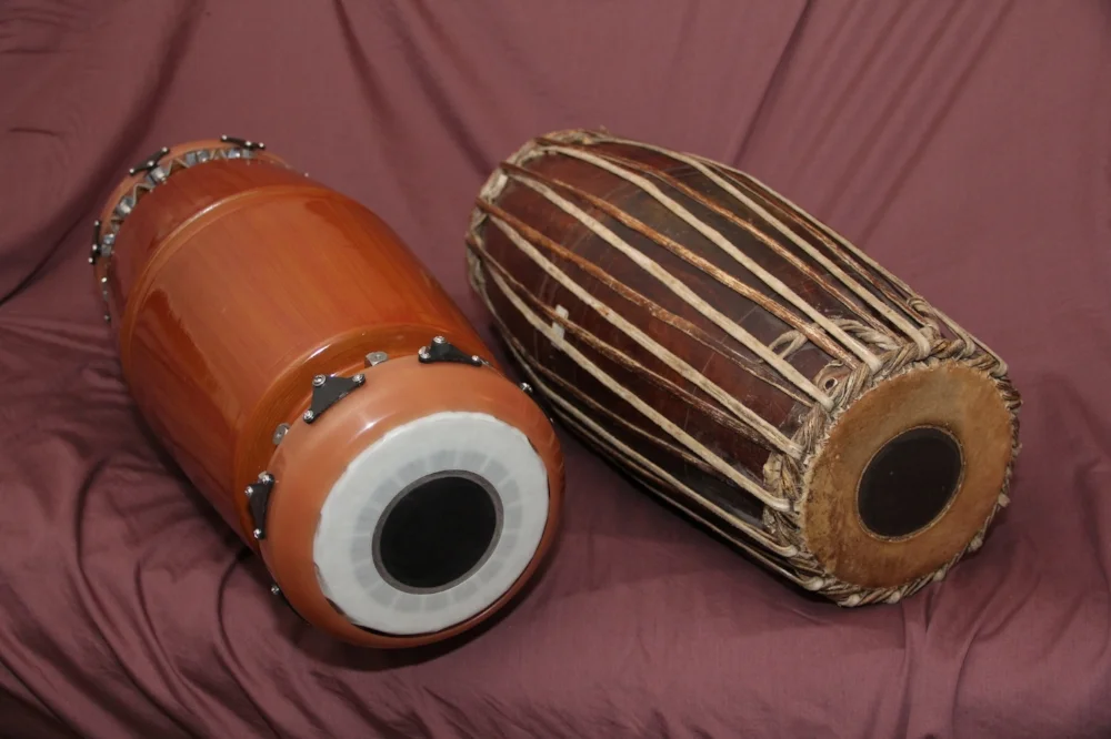 SRI mridangam (left) produces the tone of the traditional mridangam (right) without the use of wood or animal skins Image: Author