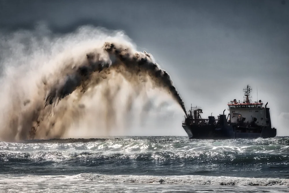 Sand being deposited as part of a beach nourishment project in Gold Coast, Australia. Image: Steve Austin/ CC BY-SA