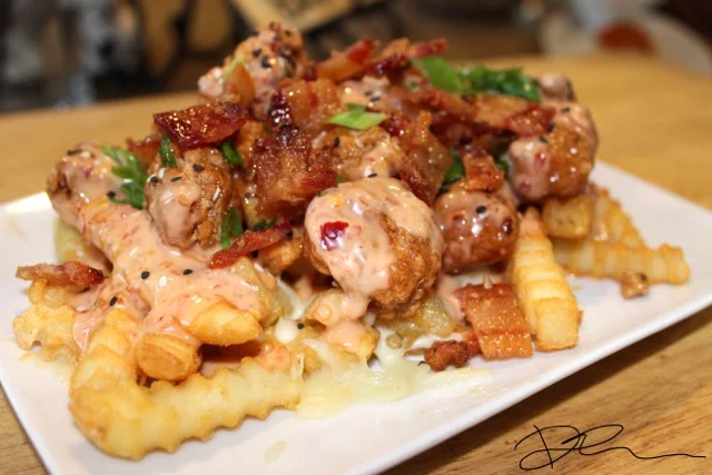 Orange Chicken Poutine with Creamy Sriracha Sauce