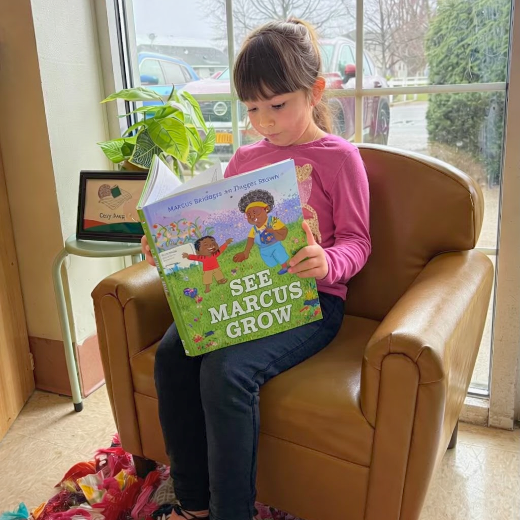 Victoria reading See Marcus Grow - Edited.png